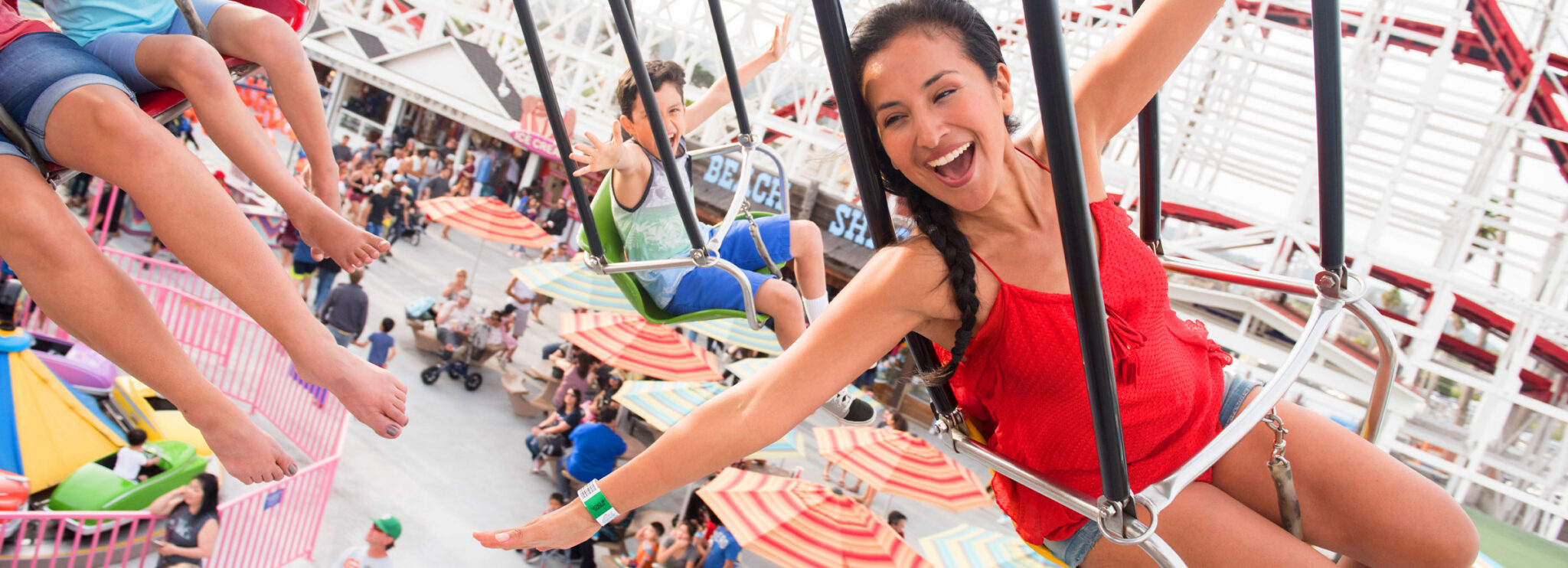 woman and boy smiling on the Sea Swings